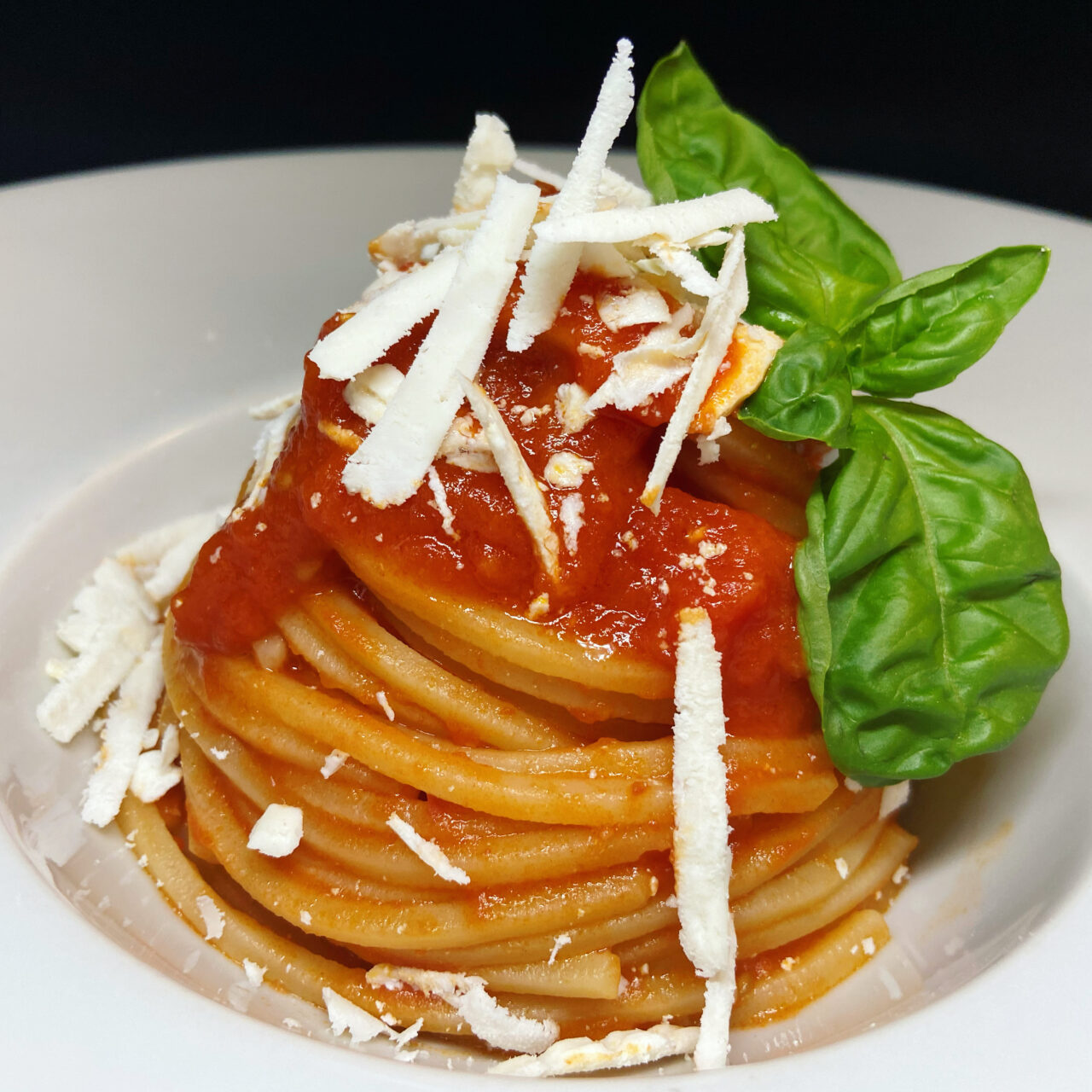 Pasta Armando Chitarra with homemade peeled tomatoes, basil and salted ricotta